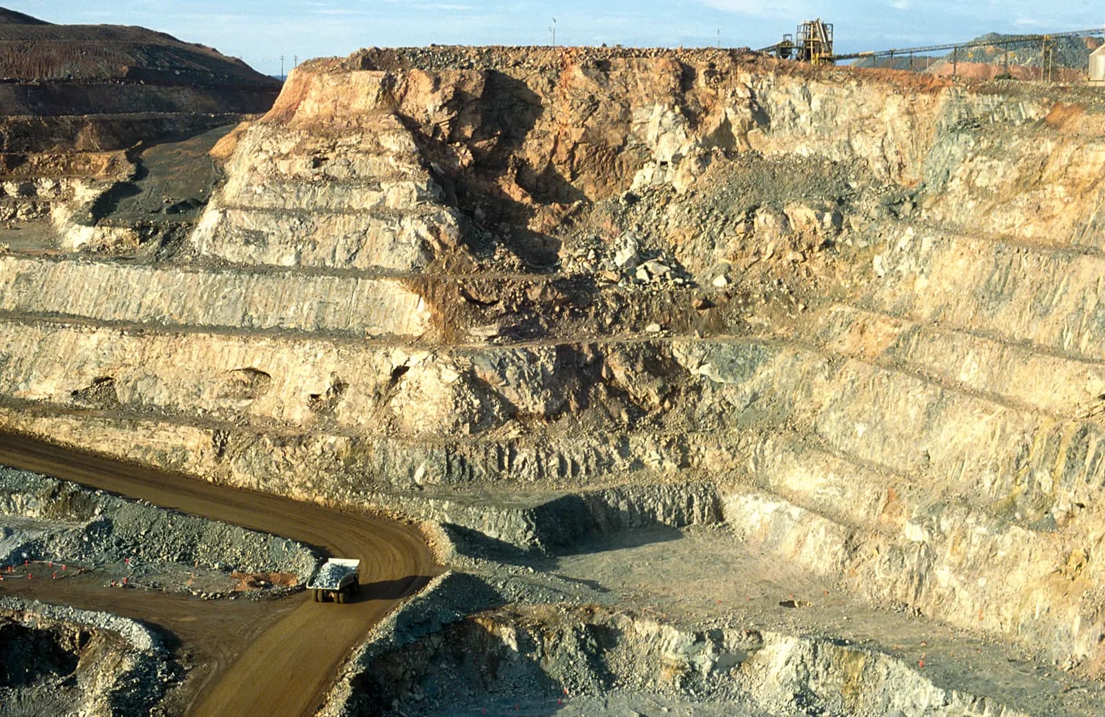 Haul truck carrying ore out of an open-pit gold mine